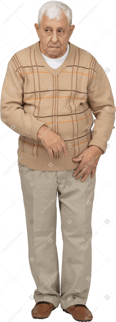Front view of an old man in casual clothes looking aside