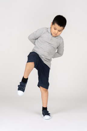 Boy with his leg up
