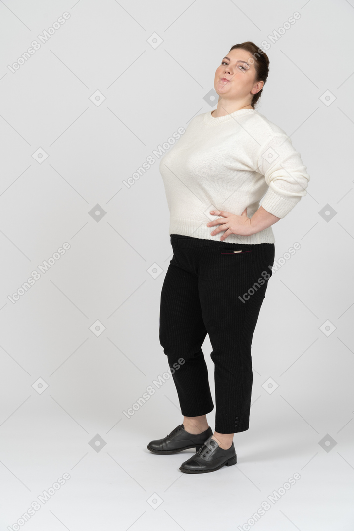 Confident plump woman in casual clothes