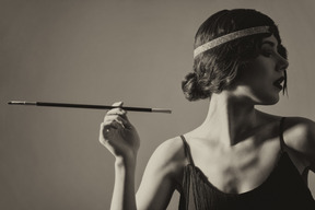 Black and white portrait of a flapper smoking cigarette