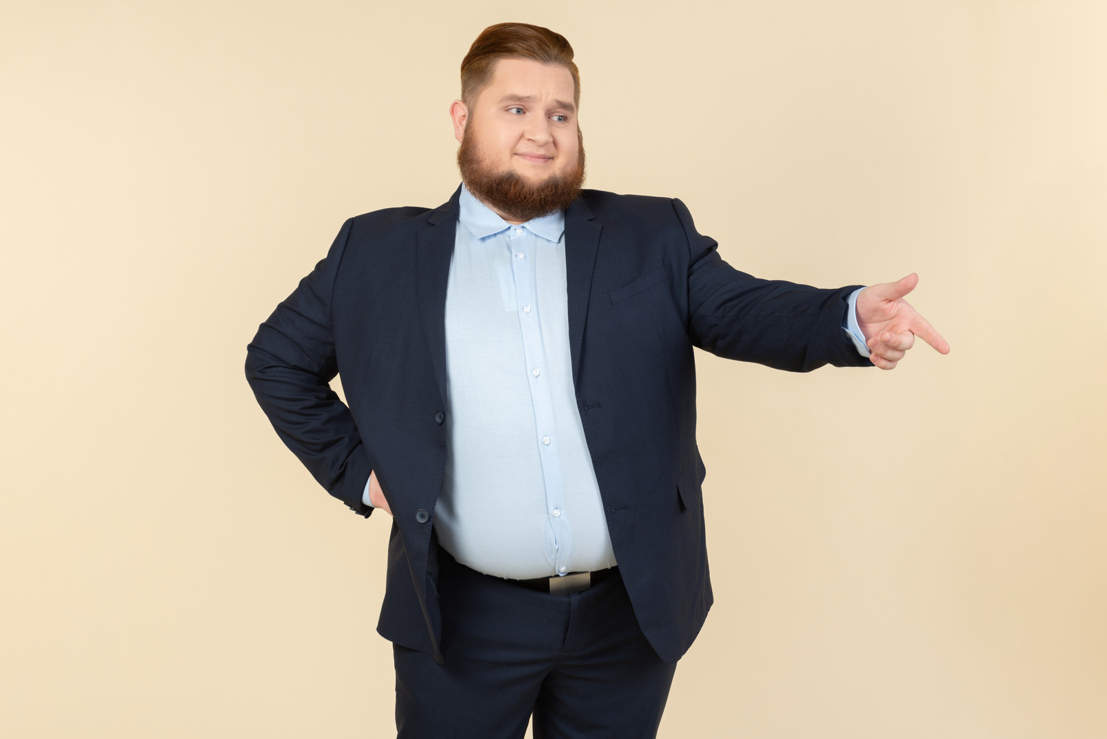 Young overweight man in suit laughing
