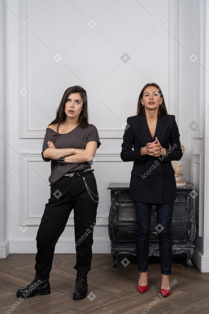 Two women looking displeased
