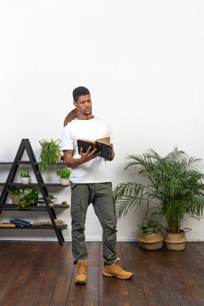 Good looking young man with a book