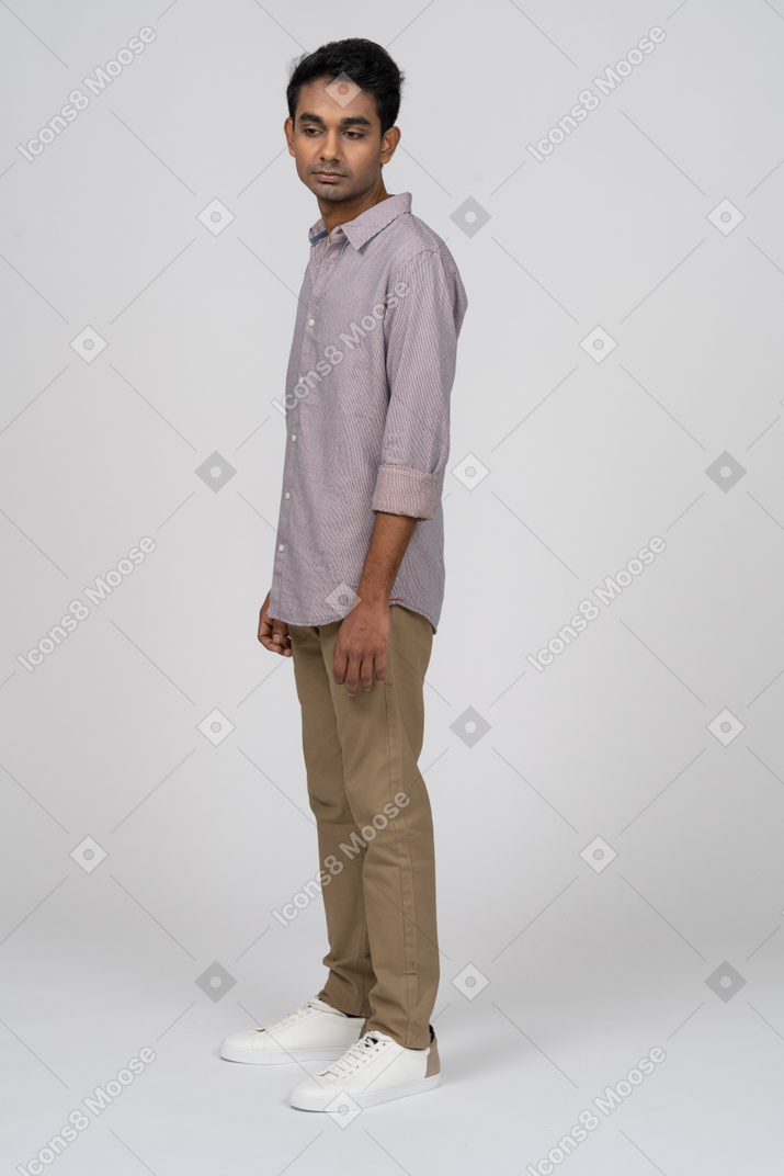 Young man in casual clothes standing