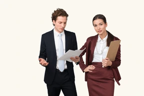 A man and a woman dressed in business attire