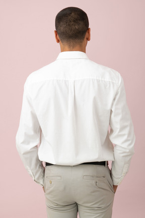 Back view of a young man standing