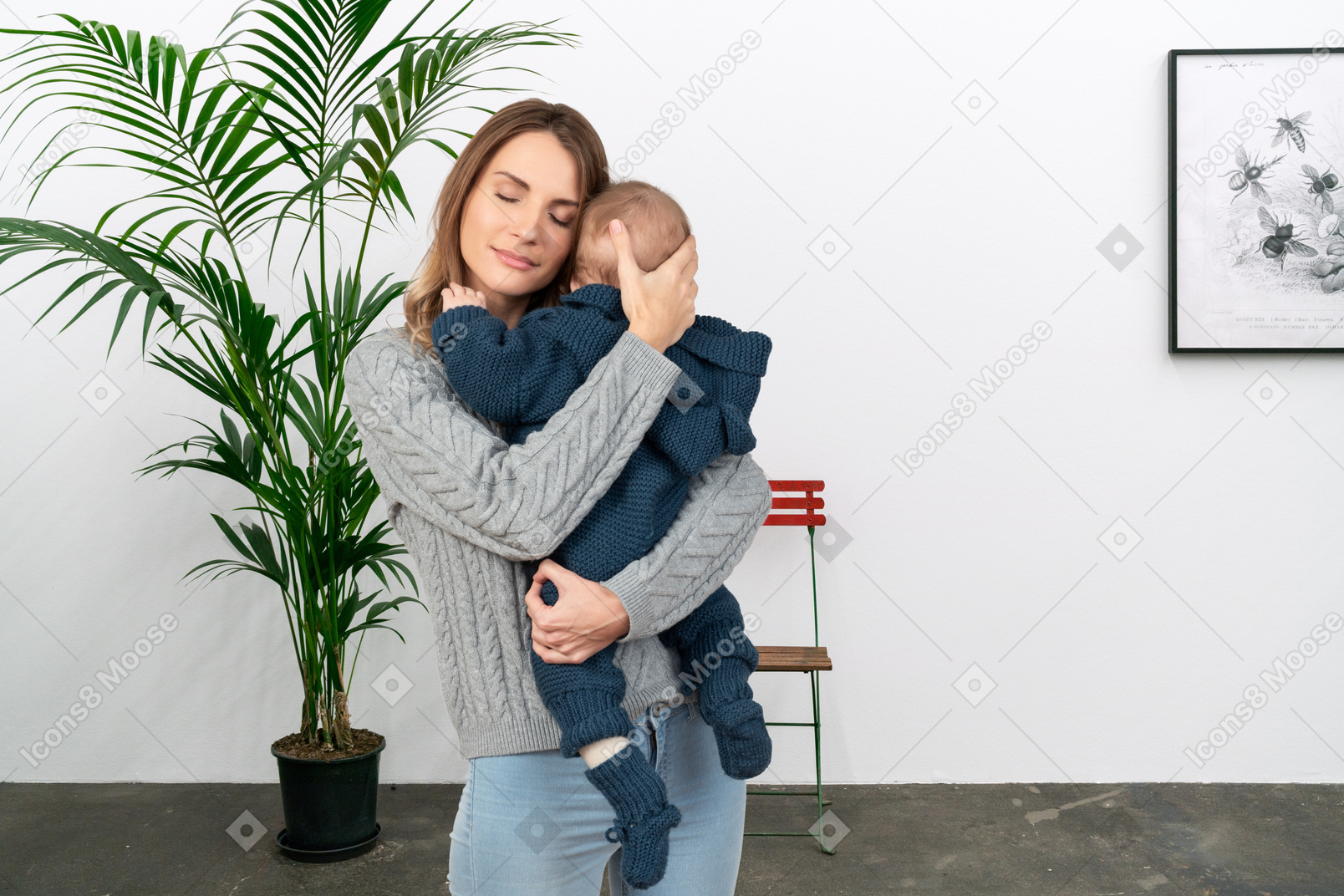 아기를 안고 있는 젊은 여성