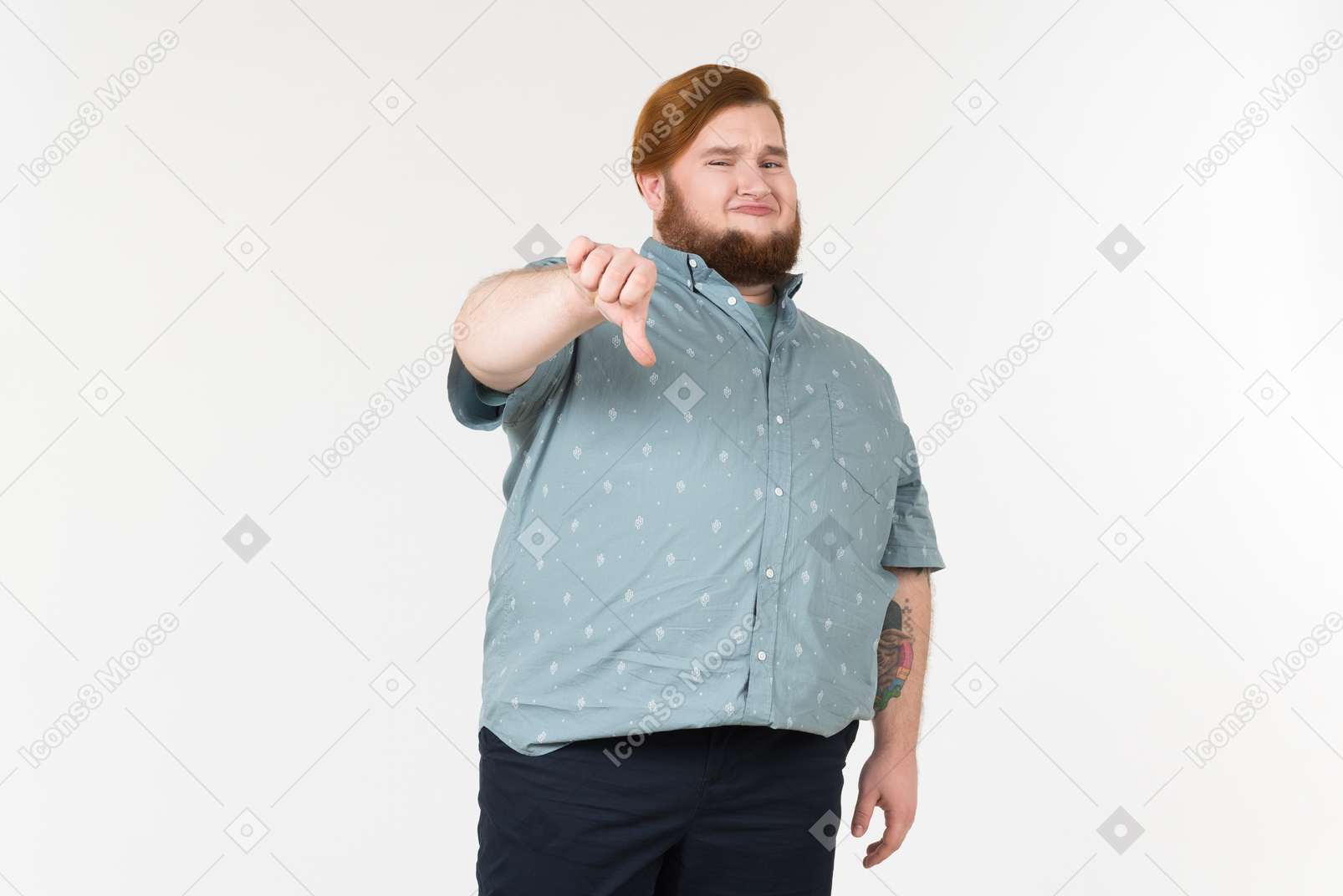 Dissatisfied young overweight man showing thumbs down