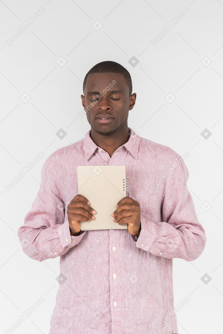 Good looking young man holding a present