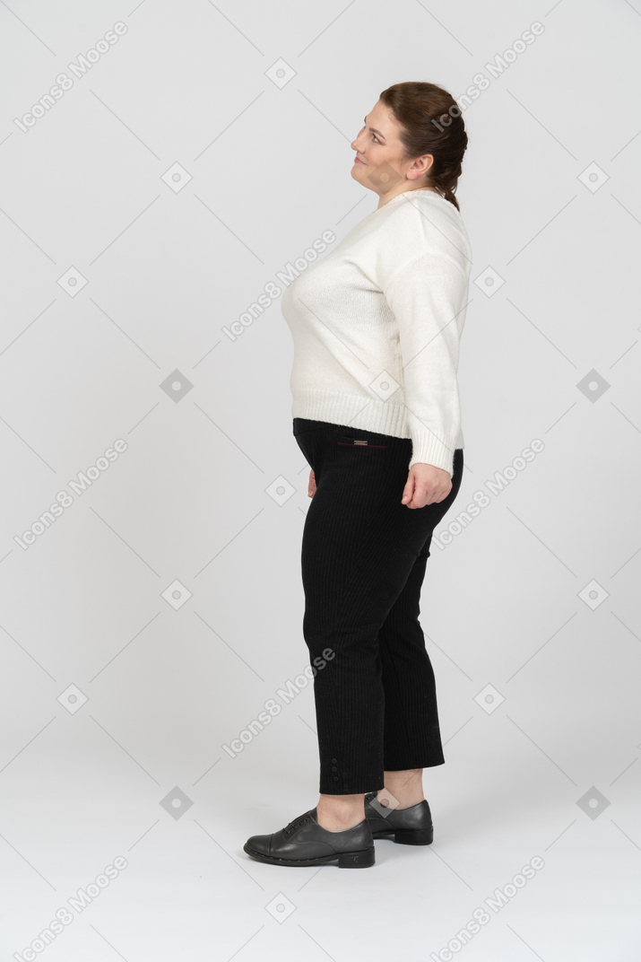 Plus size woman in casual clothes standing