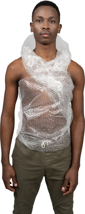 Serious african man wrapped in plastic