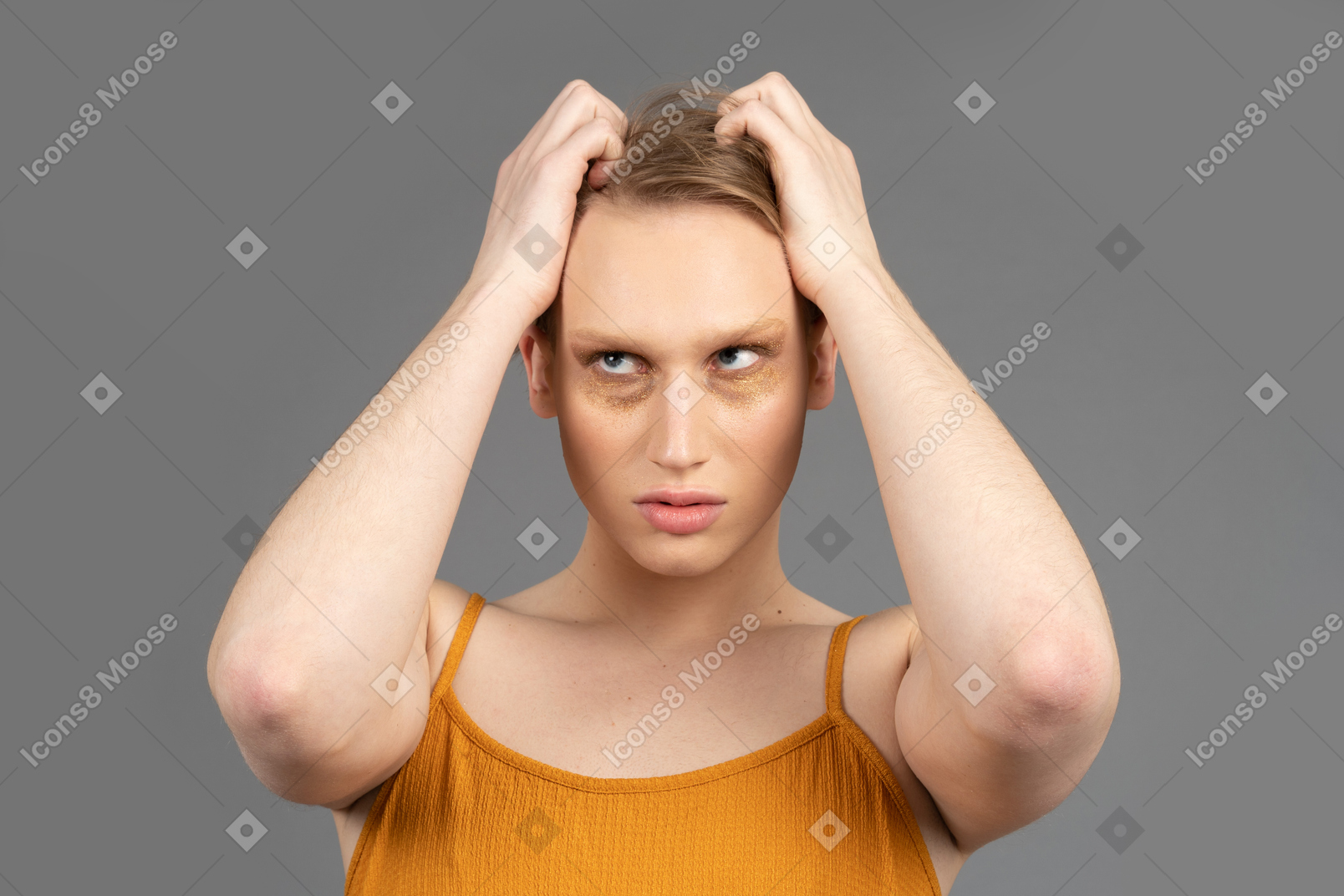 Genderqueer person scratching top of their head