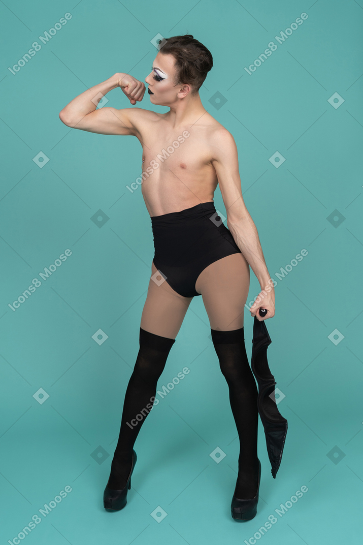 Drag queen showing arm muscles