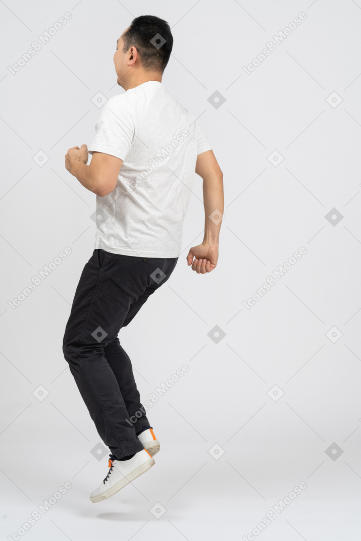 Side view of a jumping man