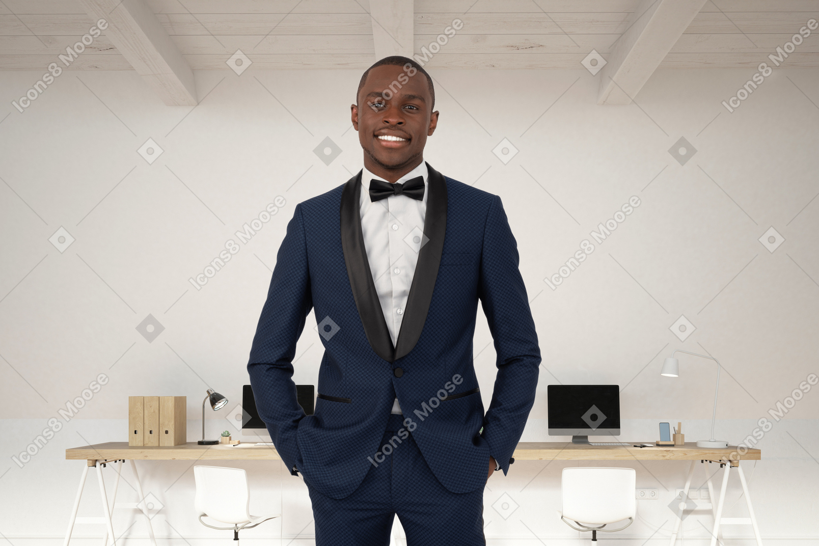 A man in a tuxedo standing in front of a desk