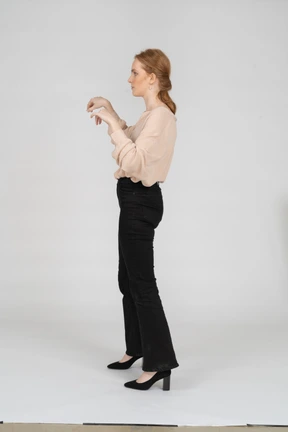 Woman in beautiful blouse standing