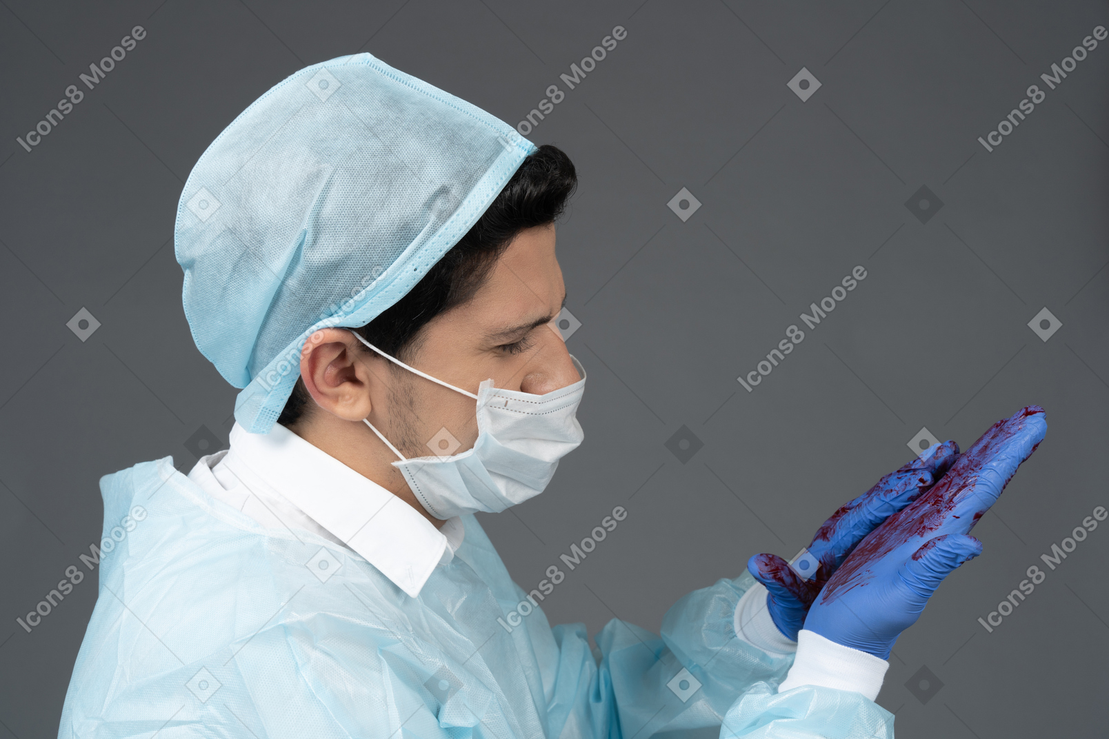 Doctor's hands covered in blood