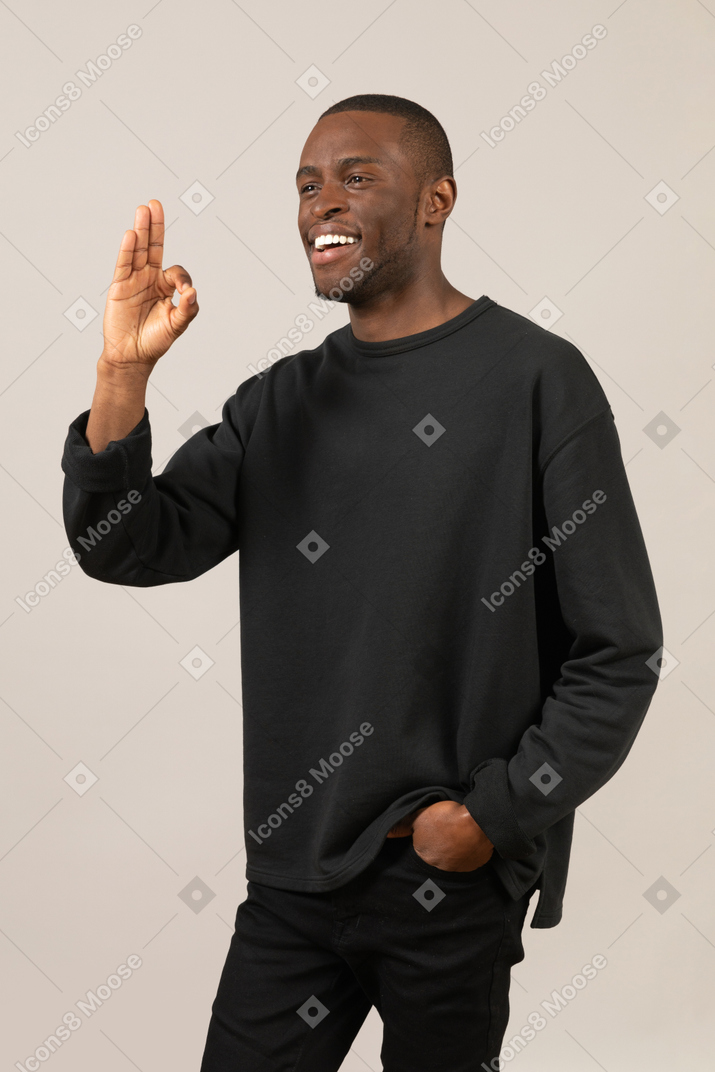 Black man giving okay gesture