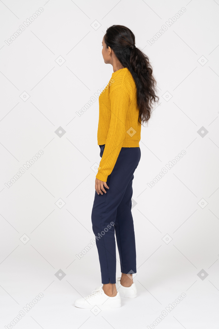 Side view of a girl in casual clothes looking aside