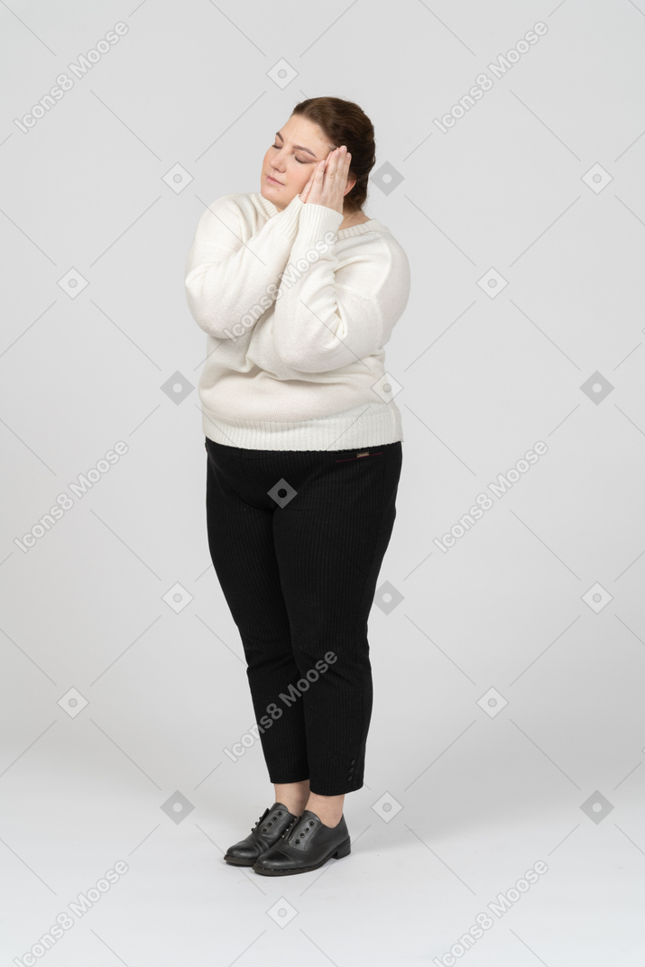 Front view of a sleepy plus size woman in casual clothes