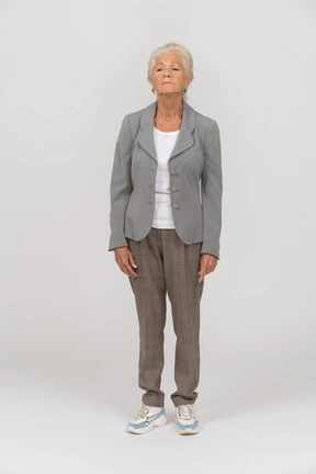 Front view of an upset old lady in suit