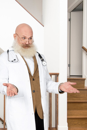 A man with a beard and a white lab coat