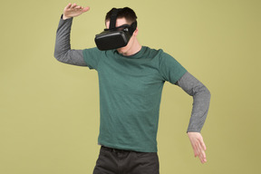 Young man wearing a virtual reality headset