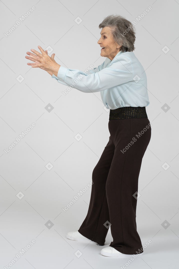 Old woman outstretching her hands