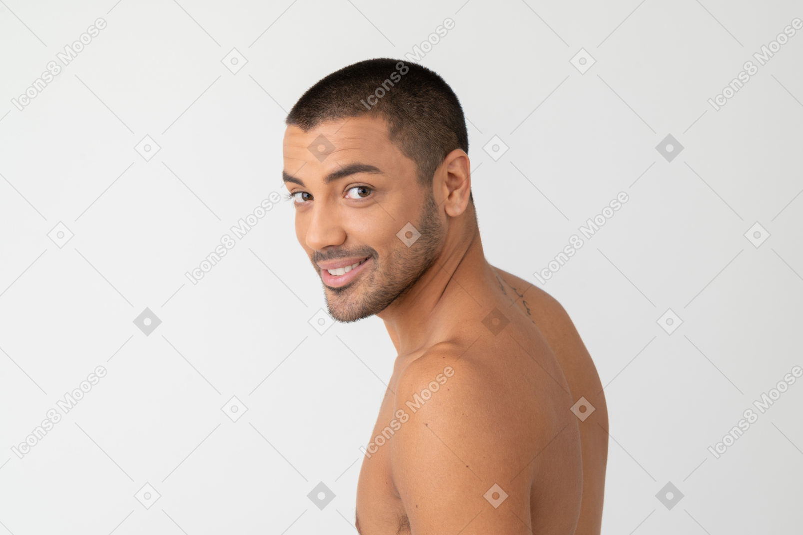 Barechested handsome young man turning his head