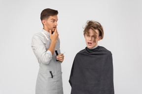 A young barber and his client