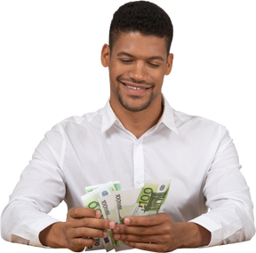 Young man counting money