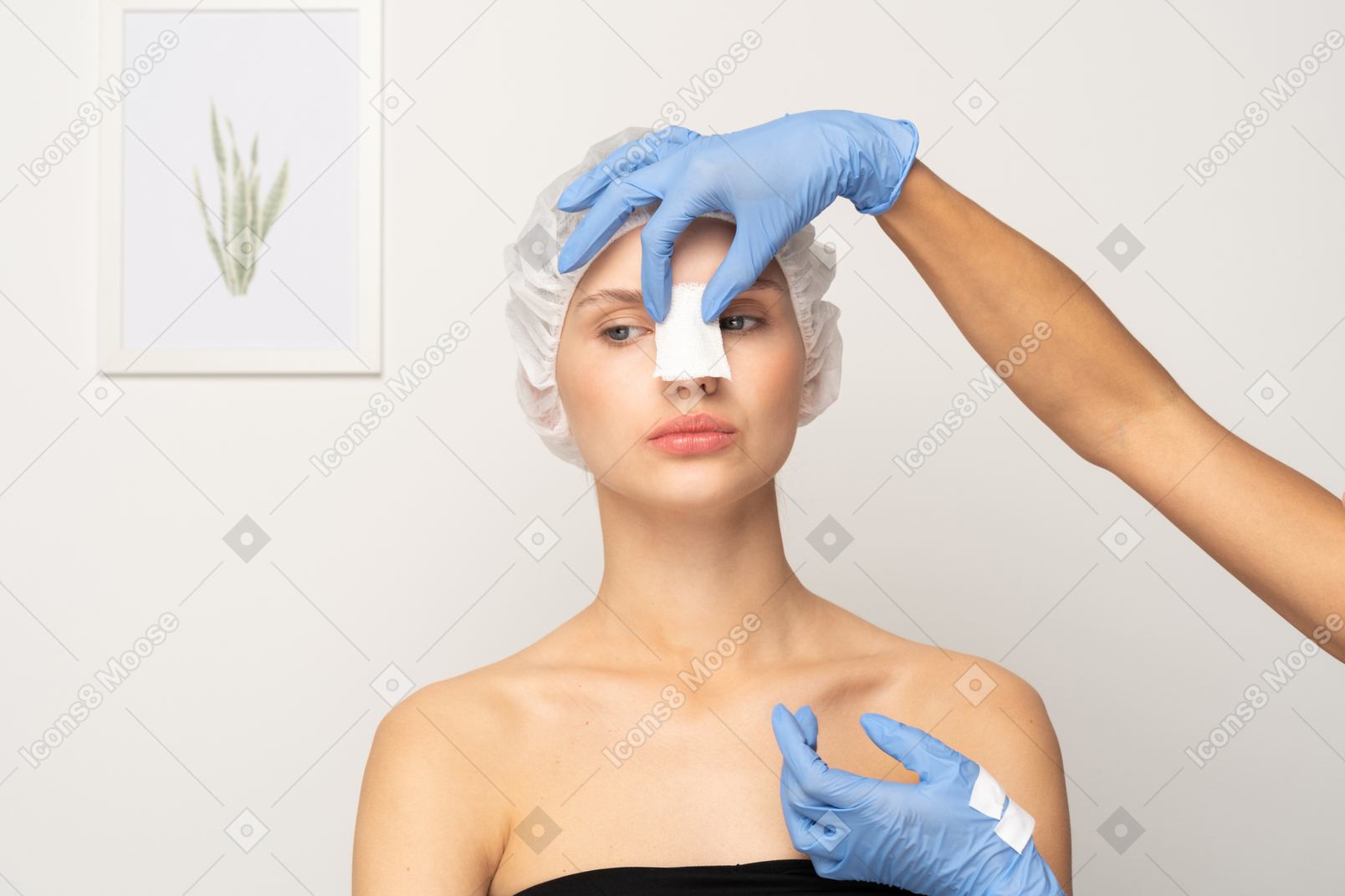 Nurse putting gauze on patient's nose