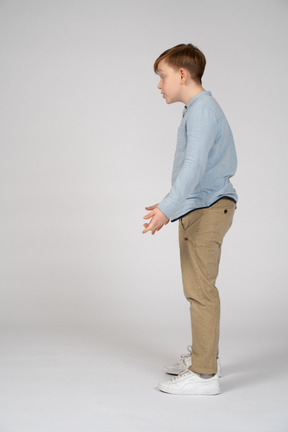 Side view of redhead boy gesturing