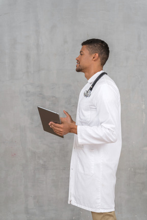 Side view of a male doctor talking