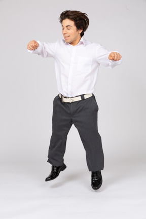 Cheerful young man jumping