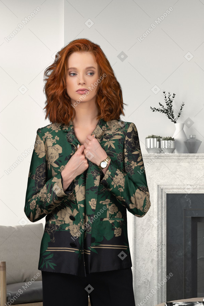 Woman with hands on her chest looking aside
