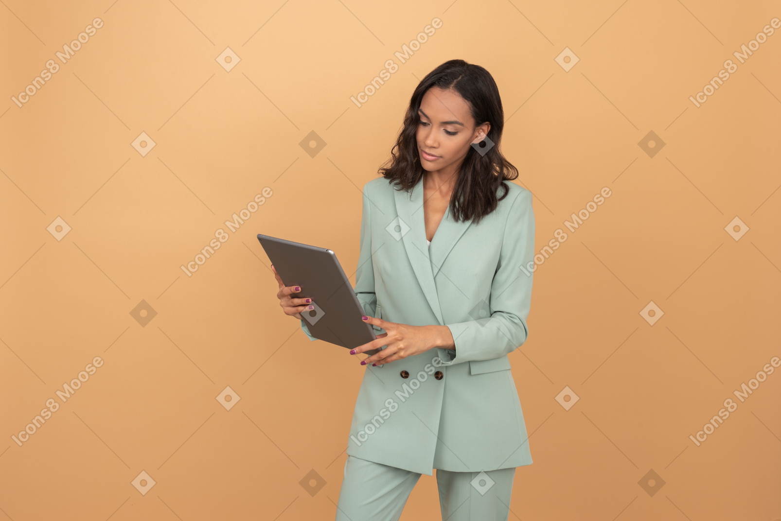 Attractive young office worker  looking at something attentively