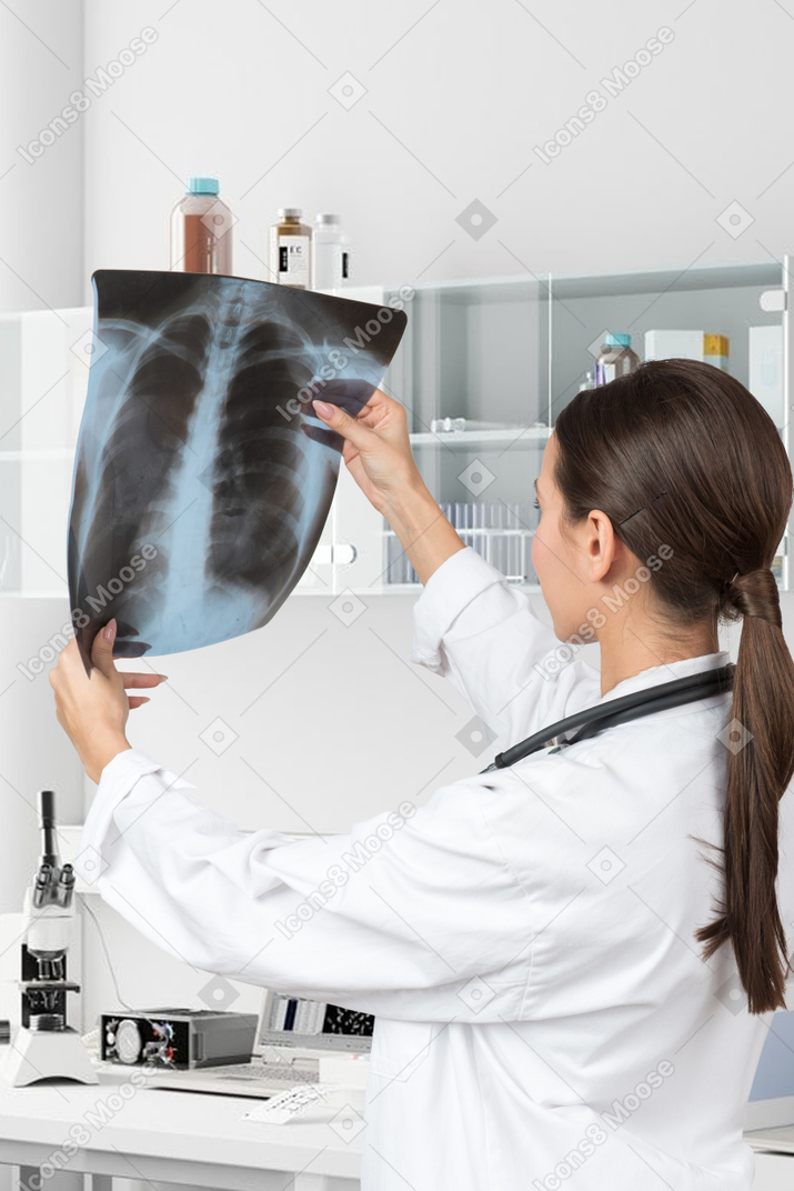 Woman doctor looking at x-ray