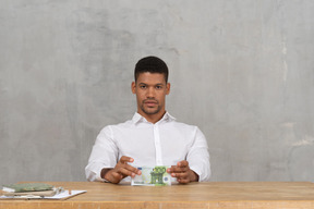 Young man holding money