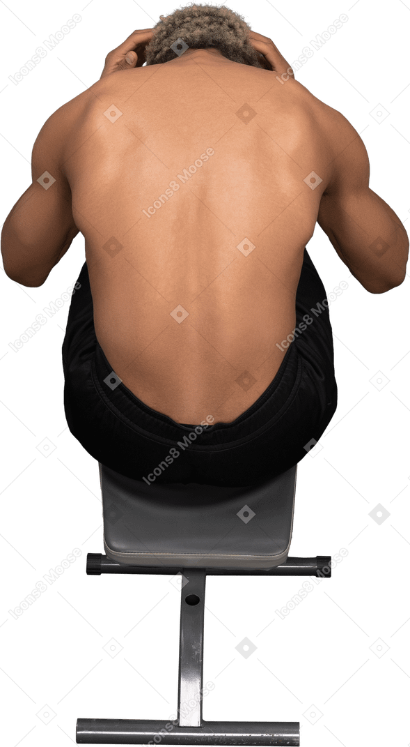 Back view of a shirtless afro man doing crunches