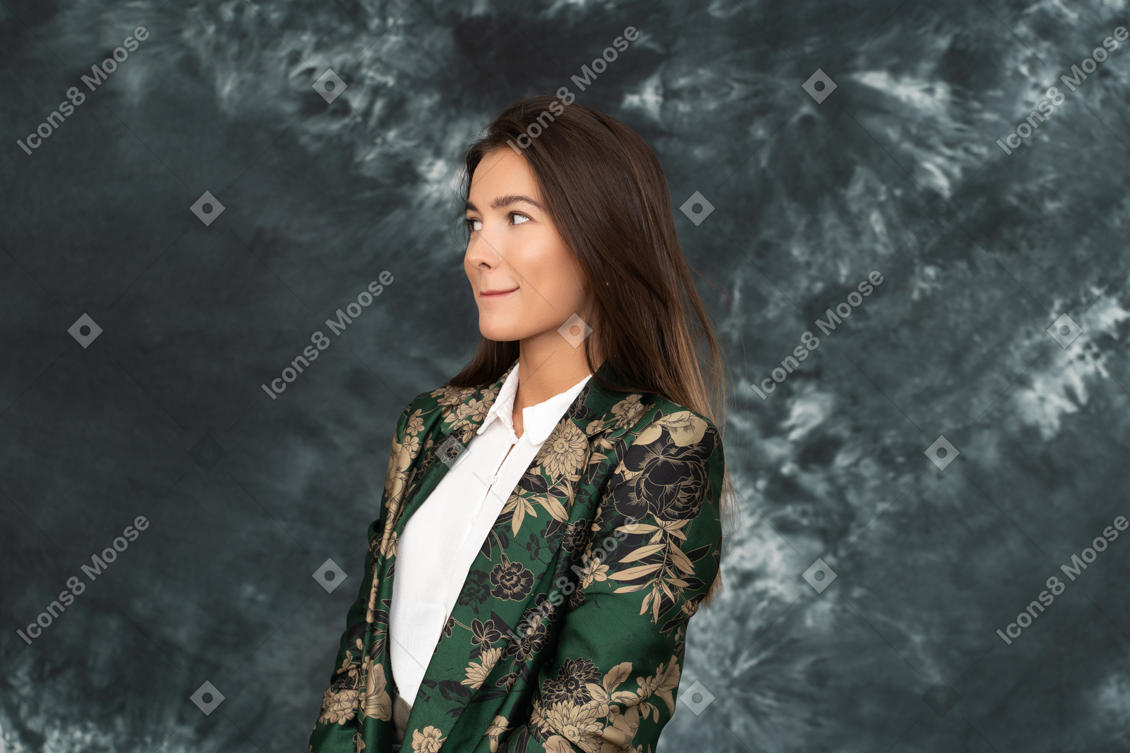 Three-quarters view of beautiful businesswoman squeezing her lips looking aside