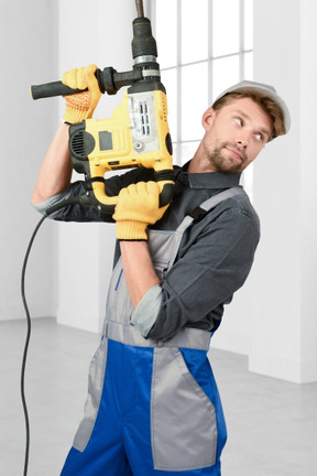 Repairman with drill