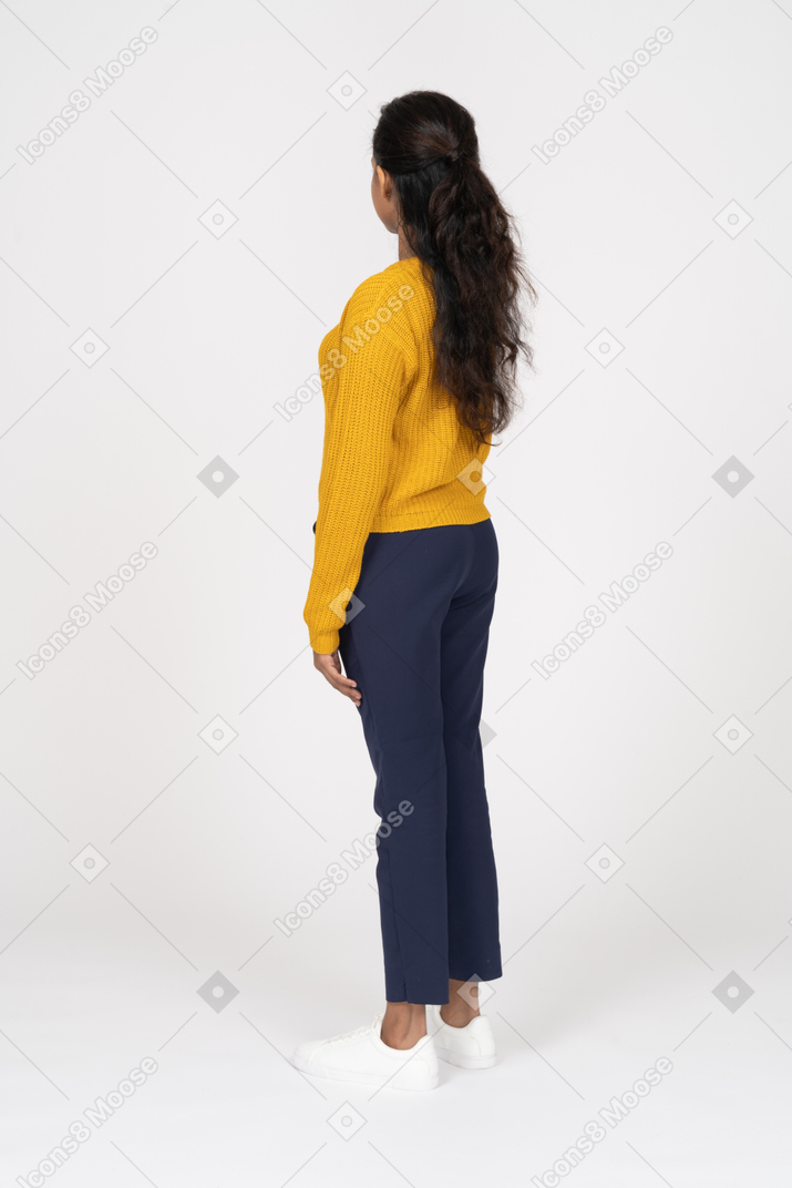 Side view of a beautiful girl in casual clothes
