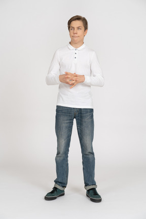 Young man in casual clothes standing