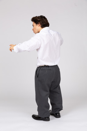 Back view of young man scolding