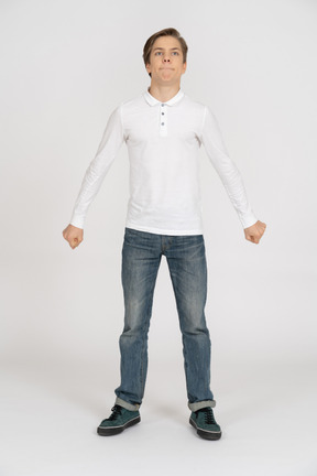 Young man in casual clothes standing