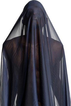 Front view of a young afro man covered with a dark blue shawl while raising his head