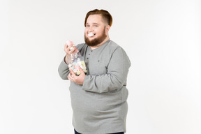 Big bearded guy eating marshmallows with eyes closed