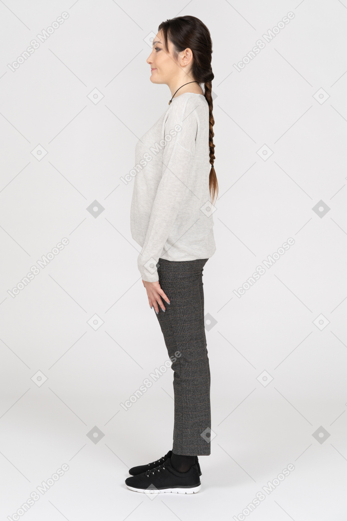 Slim caucasian brunette standing still in profile