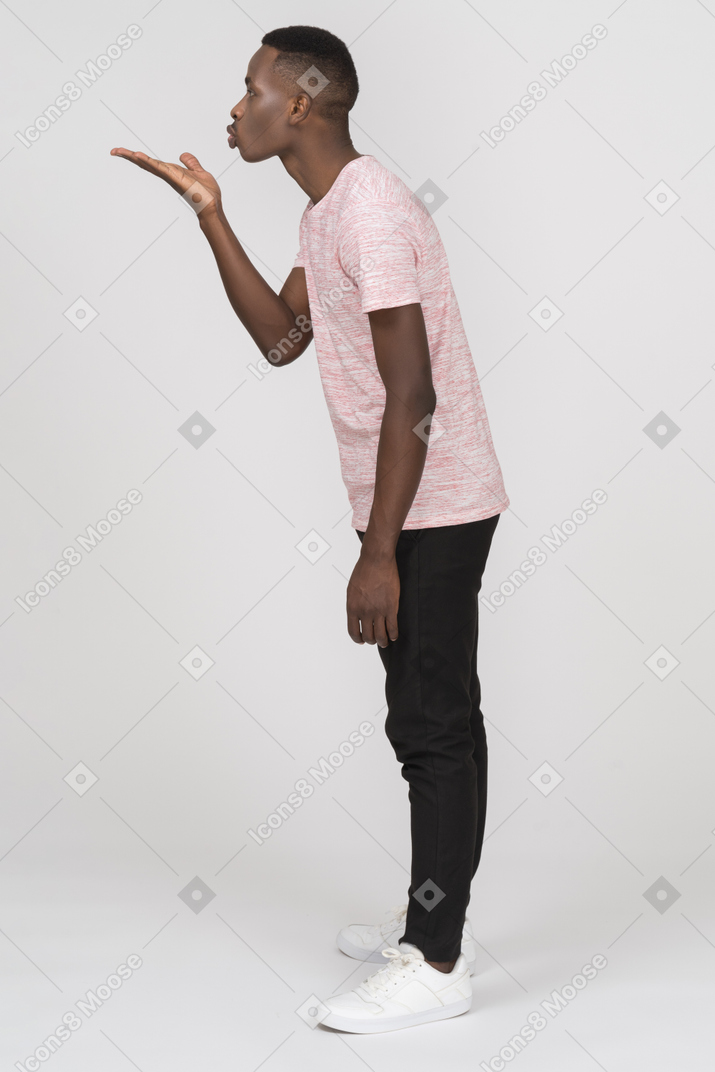 Young man blowing a kiss